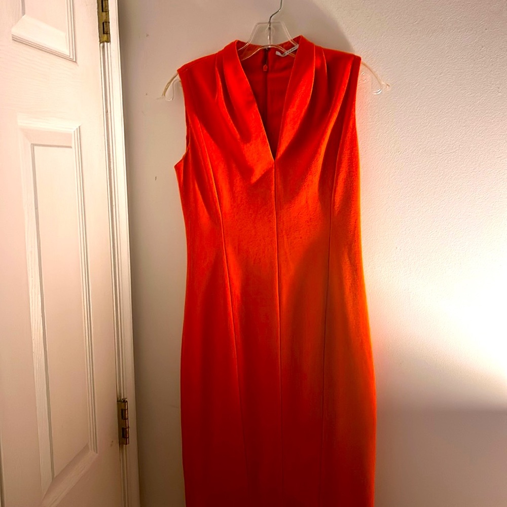 This be beautiful orange dress designed by Tahari size number two